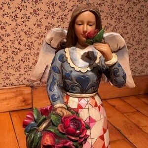 “Smell The Flowers’s” by Jim Shore